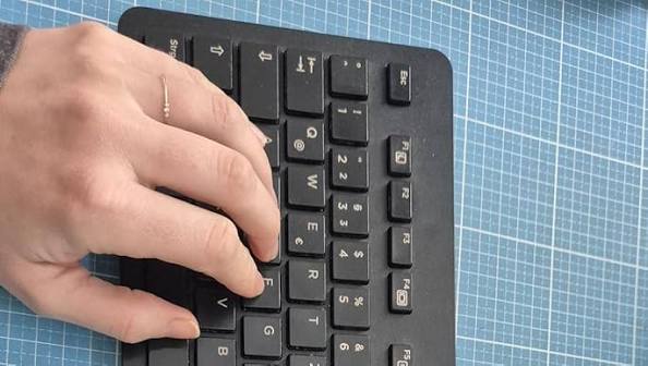 HP Slim Keyboard Side Angle View on Desk